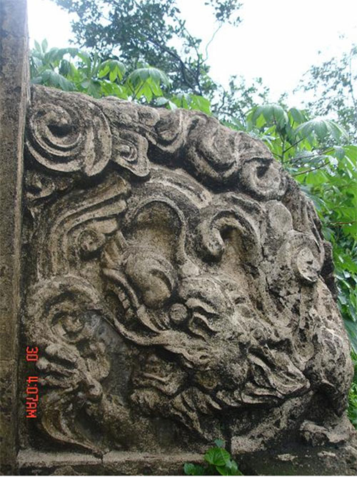 Mô-típ “lưỡng long triều dương” ở mộ cổ Cầu Xéo (Đồng Nai) - Ảnh: Nhóm khảo cổ cung cấp