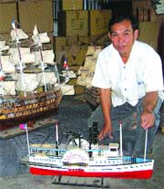 Nguyen Thanh Nhan hopes to preserve the traditional craft of making wooden models. 