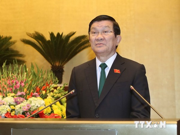 Chủ tịch nước Trương Tấn Sang trình bày Tờ trình trước Quốc hội. (Ảnh: TTXVN)