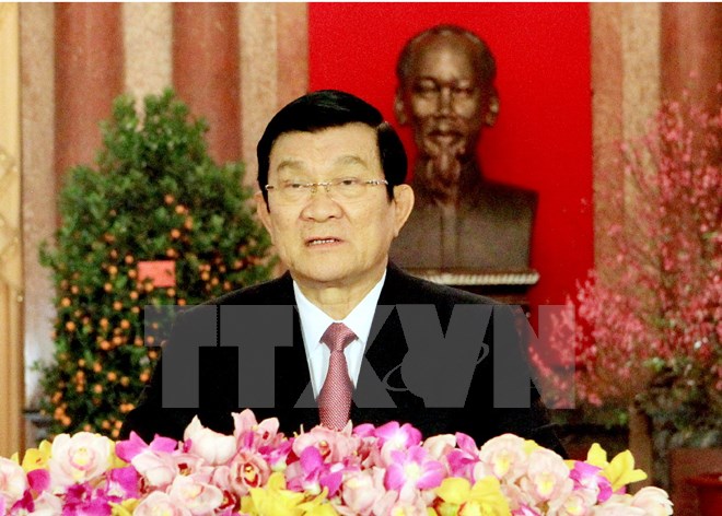 Chủ tịch nước Trương Tấn Sang đọc thư chúc Tết Ất Mùi 2015. (Ảnh: TTXVN)