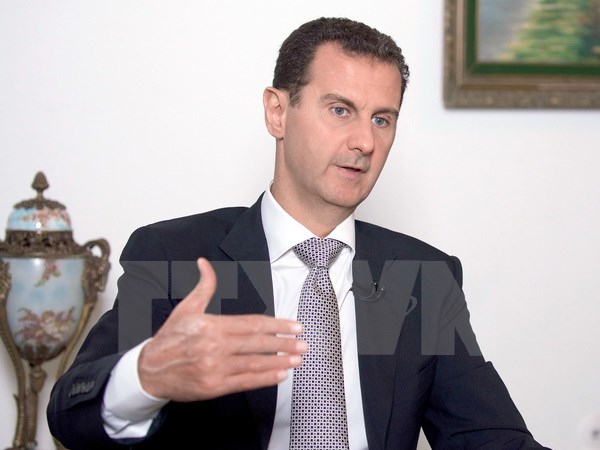 Tổng thống Syria Bashar Al-Assad trả lời phỏng vấn tại Damascus ngày 20/7. (Nguồn: EPA/TTXVN)