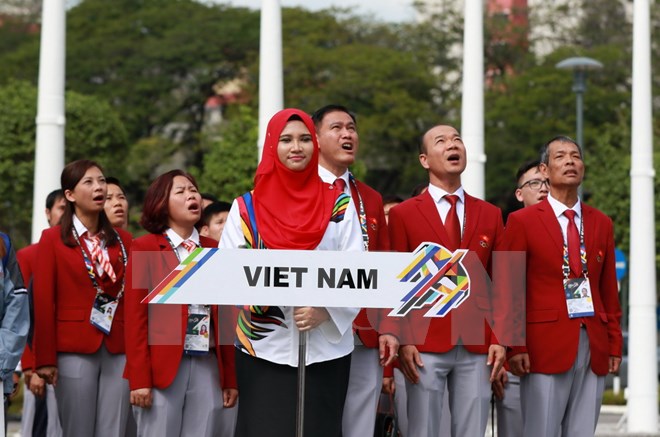  Đoàn Thể thao Việt Nam tại buổi lễ thượng cờ. (Ảnh: Quốc Khánh/TTXVN)