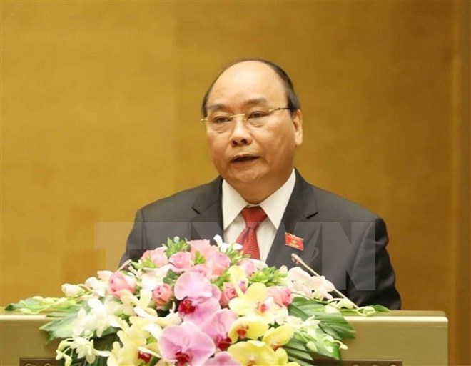 Thủ tướng Chính phủ Nguyễn Xuân Phúc trình bày Báo cáo. (Ảnh: Thống Nhất/TTXVN)
