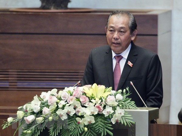Phó Thủ tướng Thường trực Chính phủ Trương Hòa Bình trình bày Báo cáo. (Ảnh: Lâm Khánh/TTXVN)