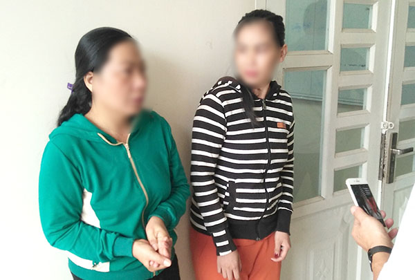 Trần Thị Kim Loan và Ngô Thị Đài bị công an bắt giữ.