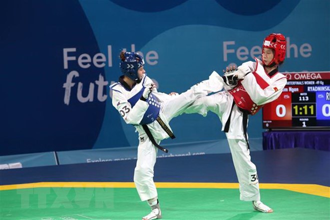 Hồ Thị Kim Ngân có một trận đấu cân sức với võ sỹ người Nga ở nội dung taekwondo hạng dưới 49kg. (Ảnh: Hoài Nam/TTXVN)