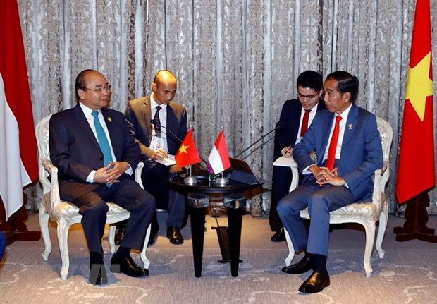  Thủ tướng Nguyễn Xuân Phúc hội kiến Tổng thống Indonesia Joko Widodo. (Ảnh: Thống Nhất/TTXVN)