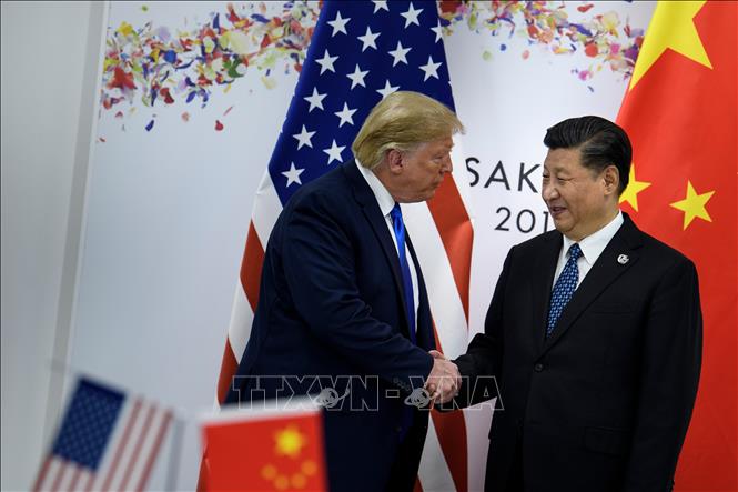Tổng thống Mỹ Donald Trump (trái) và Chủ tịch Trung Quốc Tập Cận Bình trong cuộc hội đàm bên lề Hội nghị thượng đỉnh G20 tại Osaka, Nhật Bản, ngày 29-6-2019. Ảnh: AFP/ TTXVN