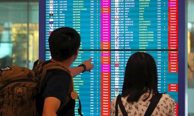 Nhiều chuyến bay bị huỷ bỏ do ảnh hưởng của bão Faxai. (Ảnh: AFP)