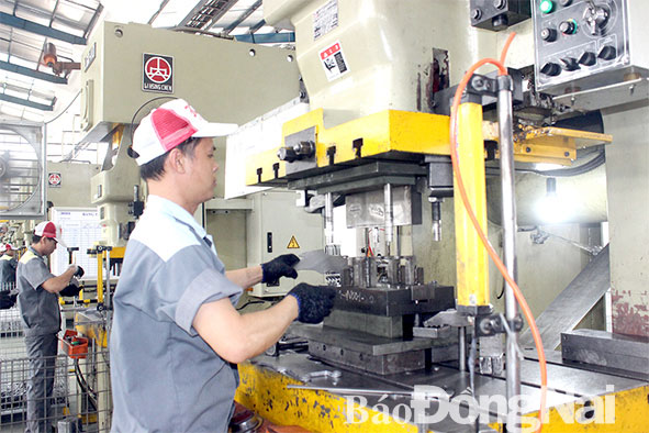  Sản xuất linh kiện máy móc xuất khẩu tại Công ty TNHH Công nghiệp Boss (Khu công nghiệp Sông Mây, H.Trảng Bom). Ảnh: H.Giang