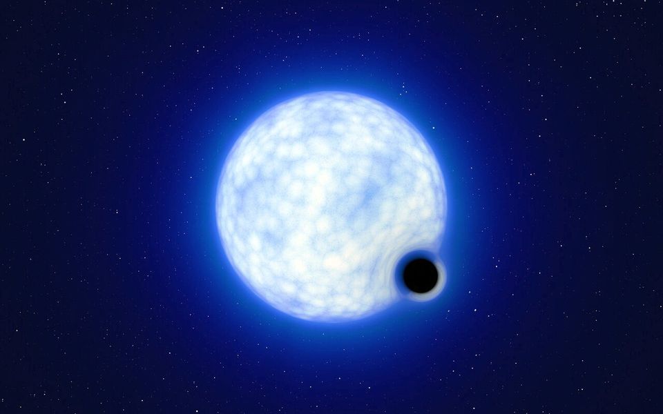 An artist’s impression showing what the binary star system VFTS 243 – containing a black hole and a large luminous star orbiting each other - might look like if we were observing it up close is seen in this undated handout image. The system, which is located in the Tarantula Nebula in the Large Magellanic Cloud galaxy, is composed of a hot, blue star with 25 times the sun’s mass and a black hole, which is at least nine times the mass of the sun. ESO/L.
