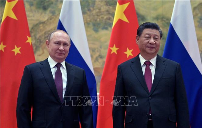 Tổng thống Nga Vladimir Putin (trái) và Chủ tịch Trung Quốc Tập Cận Bình tại cuộc gặp ở Bắc Kinh, ngày 4-2-2022. Ảnh (tư liệu): AFP/TTXVN